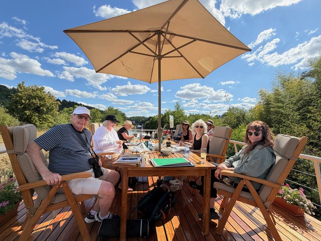 Art Cruise guests painting together on Luciole's sundeck
