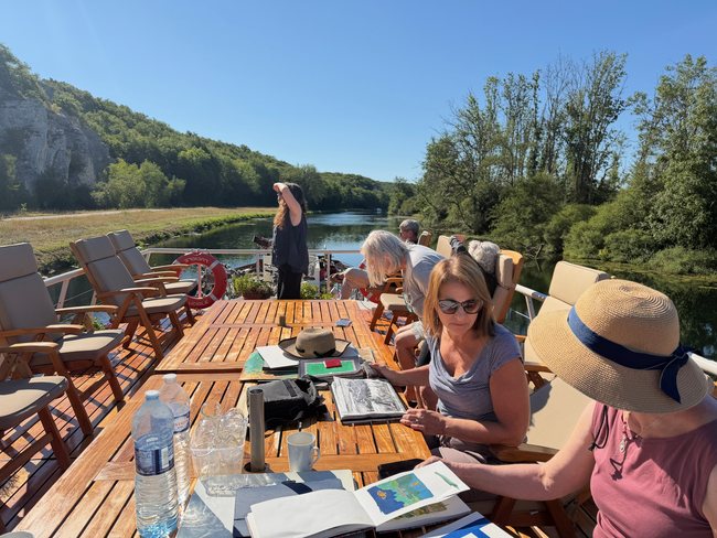 Guests painting together aboard Hotel Barge Luciole