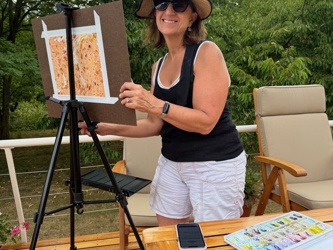 Guest painting the Burgundy landscape aboard Luciole